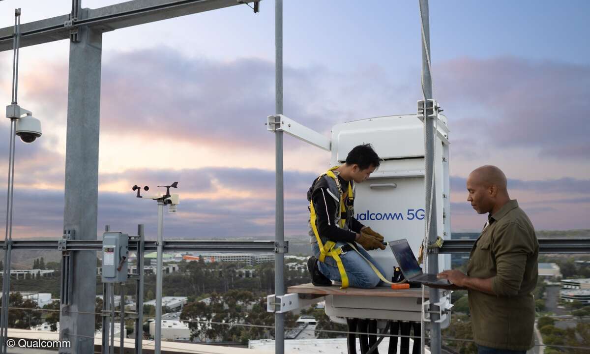 Engineers on rooftop testing 5G
