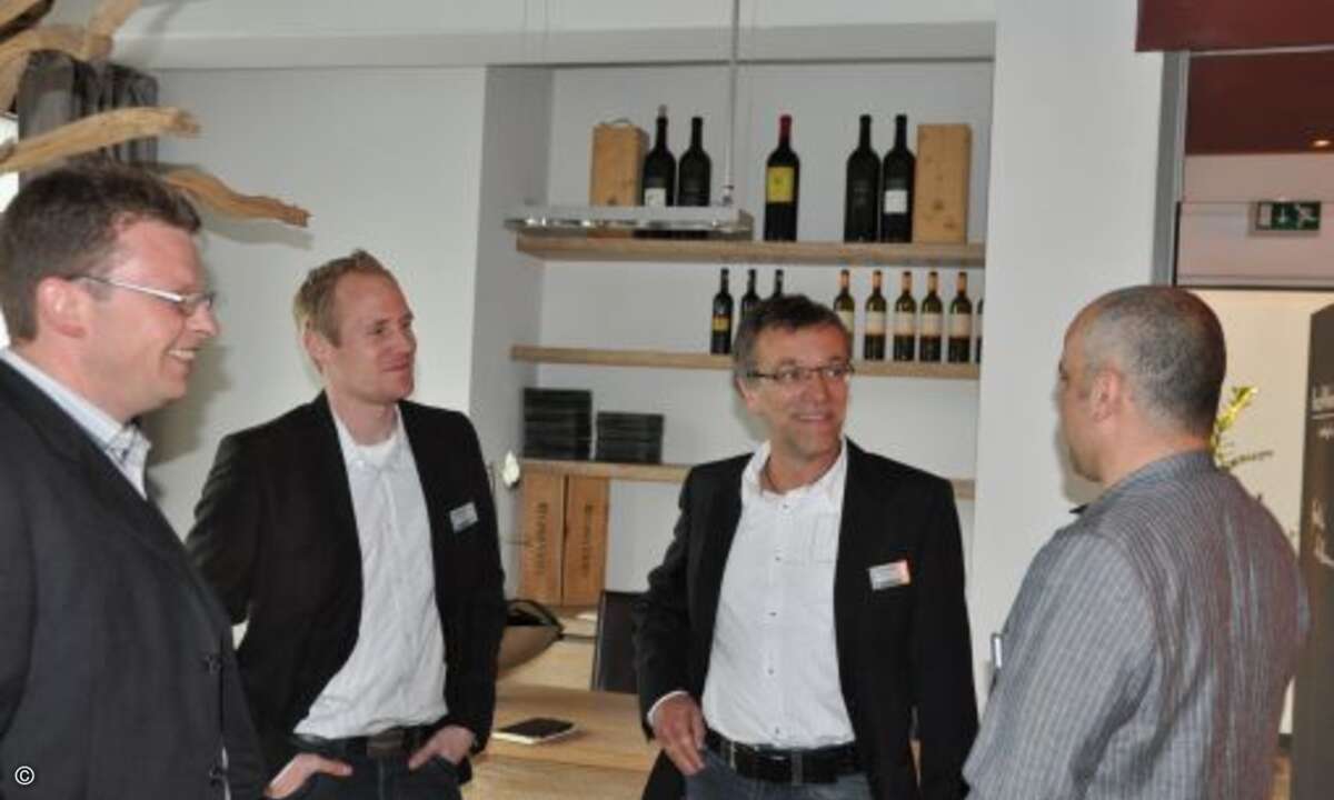 Holger Neumann, Andreas Müller und Thomas Preibisch von B.Com im Gespräch mit Silvan Tatzel von Microsoft