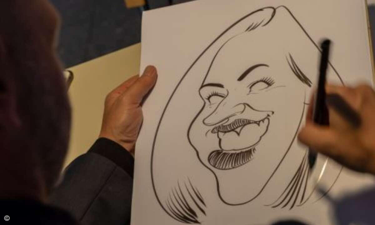 Wer wollte, konnte auch eine Karikatur von sich zeichnen lassen (Foto: Thomas Geiger - NürnbergMesse)