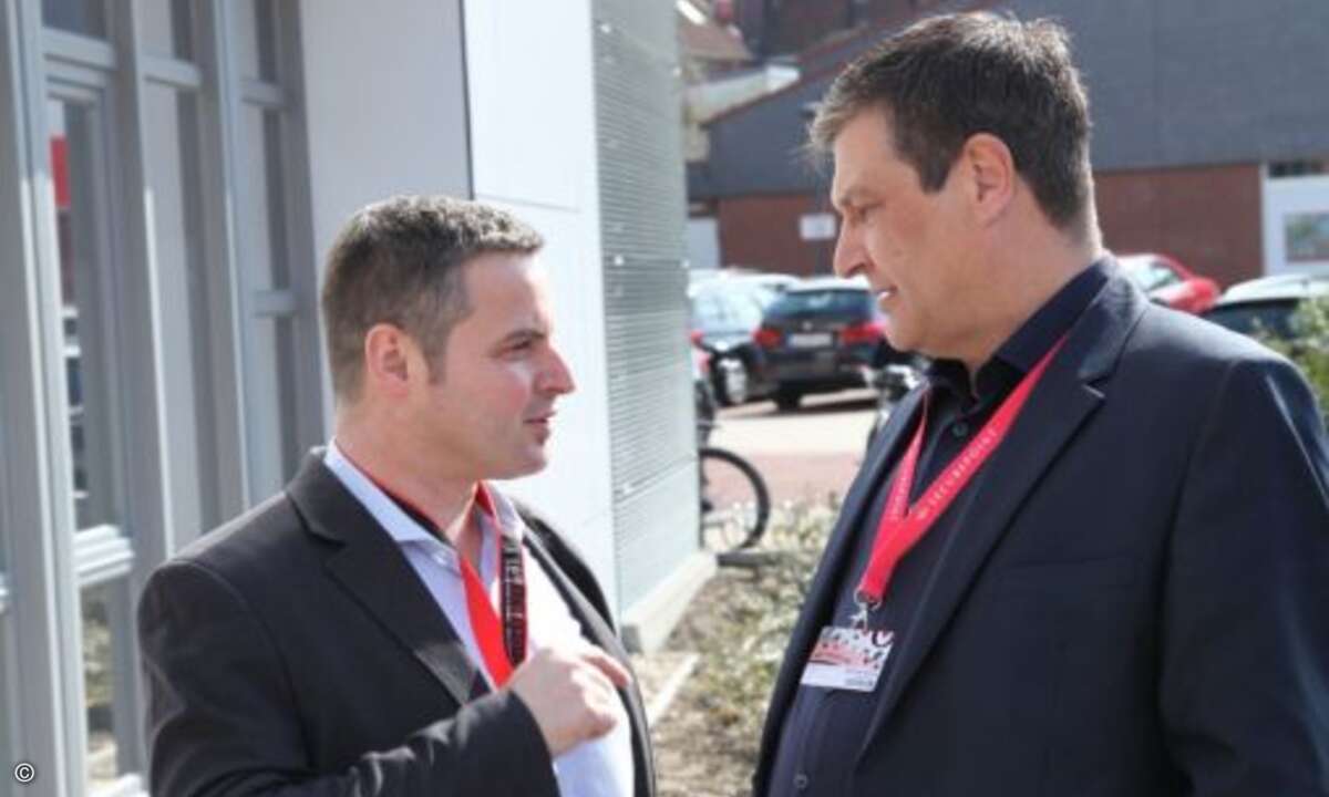 Thomas Moritz von Telcat Multicom tauscht sich mit Michael Behnk von Securepoint aus (Foto: Securepoint)