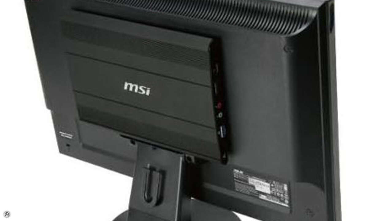 Die Wind NetBox wird platzsparend hinten am Monitor montiert