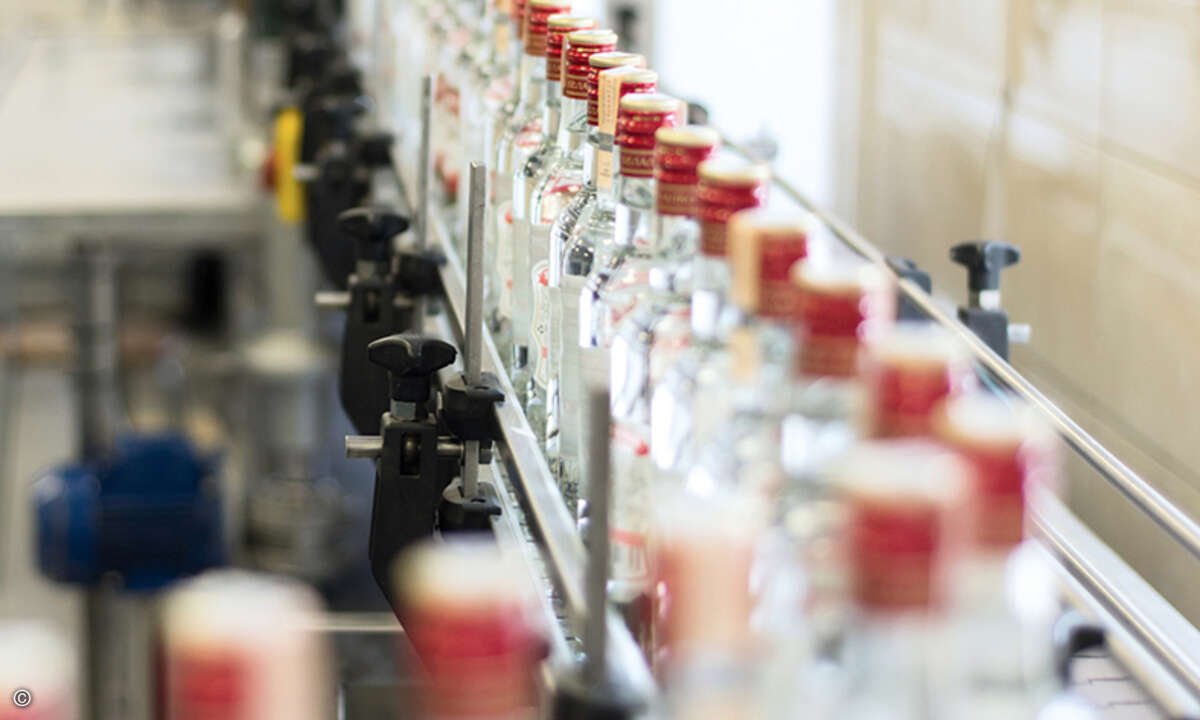 Brest Distillery. The conveyor with bottles of vodka